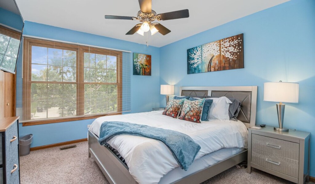 a blue-themed bedroom of a corporate home rental